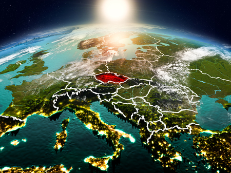 Sunrise above Czech republic highlighted in red on model of planet Earth in space with visible country borders. 3D illustration.の写真素材