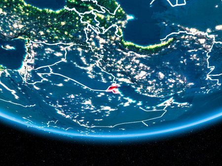 Kuwait in red with visible country borders and city lights from space at night. 3D illustration.の写真素材