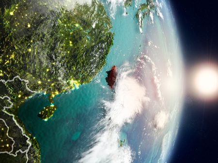 Taiwan during sunrise highlighted in red on planet Earth with visible country borders. 3D illustration.の写真素材
