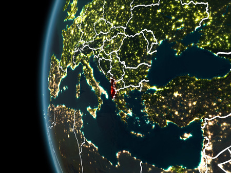 Orbit view of Albania highlighted in red with visible borderlines and city lights on planet Earth at night. 3D illustration.の写真素材