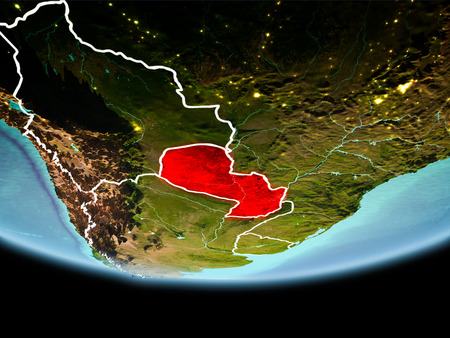 Country of Paraguay in red on planet Earth in the evening with visible border lines and city lights. 3D illustration.の写真素材