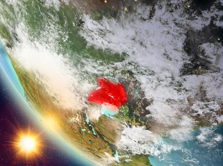 Uganda during sunset highlighted in red on planet Earth with clouds. 3D illustration.の写真素材