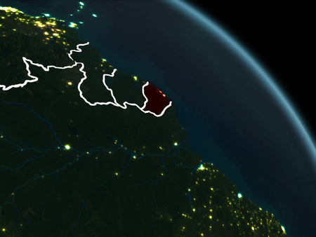 French Guiana from orbit of planet Earth at night with visible borderlines and city lights. 3D illustration.の写真素材
