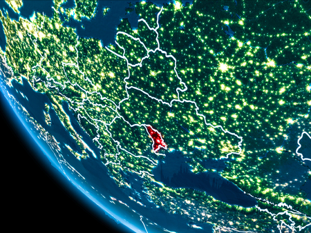 Map of Moldova in red as seen from space on planet Earth at night with white borderlines and city lights. 3D illustration.の写真素材