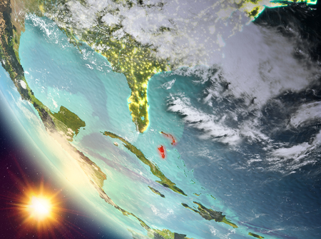 Bahamas during sunset highlighted in red on planet Earth with clouds. 3D illustration.の写真素材