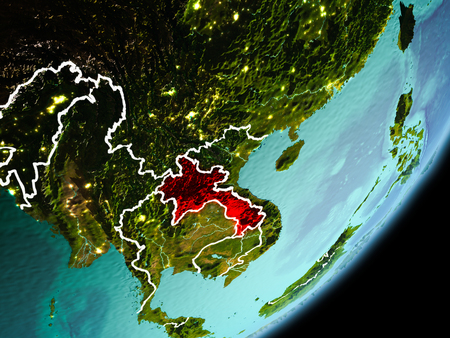 Laos in early morning light highlighted in red on planet Earth with visible border lines and city lights. 3D illustration.の写真素材