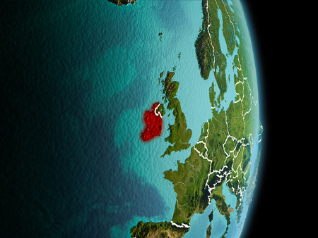 Satellite morning view of Ireland highlighted in red on planet Earth with visible border lines and city lights. 3D illustration.の写真素材
