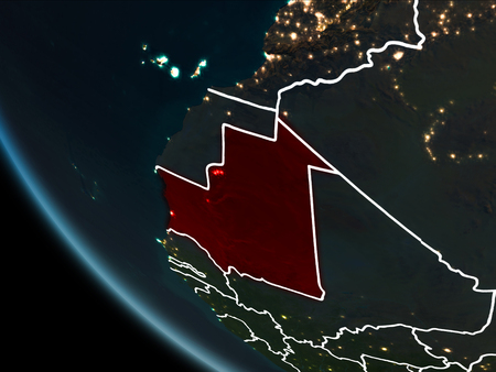 Satellite view of Mauritania highlighted in red on planet Earth at night with borderlines and city lights. 3D illustration.の写真素材