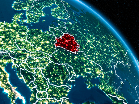 Satellite view of Belarus highlighted in red on planet Earth at night with borderlines and city lights. 3D illustration.の写真素材