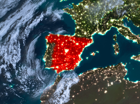 Country of Spain in red on planet Earth with clouds at night. 3D illustration.の写真素材