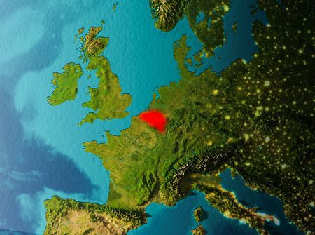 Belgium in early morning light highlighted in red on planet Earth. 3D illustration.の写真素材