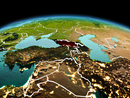 Morning above Georgia highlighted in red on model of planet Earth in space with visible border lines and city lights. 3D illustration.の写真素材