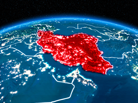 Orbit view of Iran highlighted in red with visible borderlines and city lights on planet Earth at night. 3D illustration.の写真素材