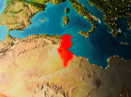 Tunisia in early morning light highlighted in red on planet Earth. 3D illustration.の写真素材