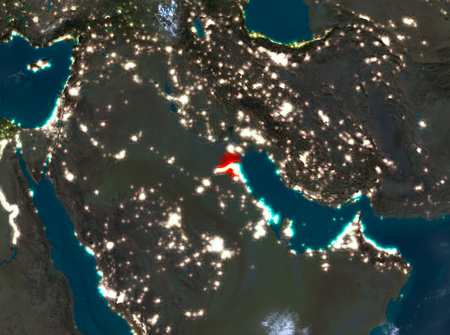 Country of Kuwait in red on planet Earth with clouds at night. 3D illustration.の写真素材