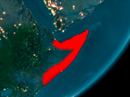 Night view of Somalia highlighted in red on planet Earth with atmosphere. 3D illustration.の写真素材