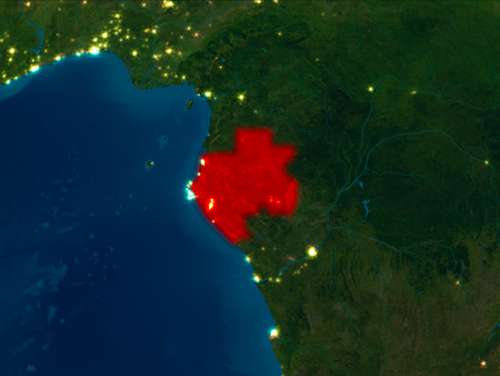 Satellite night view of Gabon highlighted in red on planet Earth. 3D illustration.の写真素材