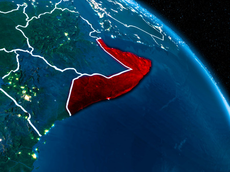 Satellite view of Somalia highlighted in red on planet Earth at night with borderlines and city lights. 3D illustration.の写真素材