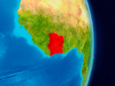 Country of Ivory Coast in red on planet Earth. 3D illustration.の写真素材