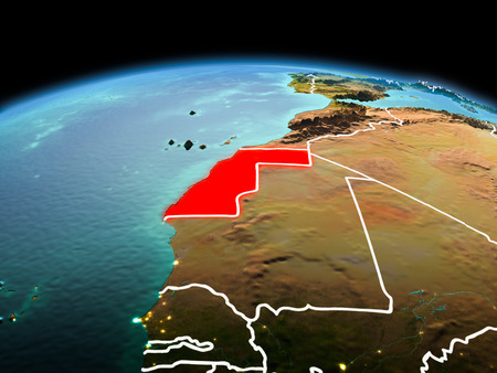 Morning above Western Sahara highlighted in red on model of planet Earth in space with visible border lines and city lights. 3D illustration.の写真素材