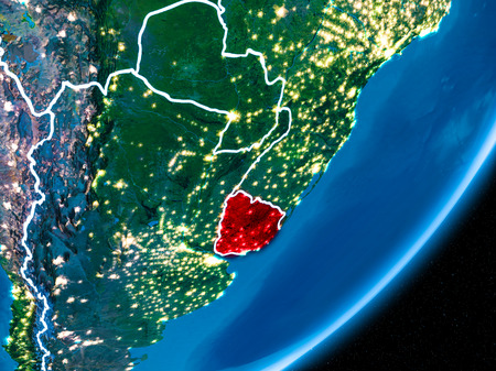 Uruguay in red on planet Earth at night with visible borderlines and city lights. 3D illustration.の写真素材