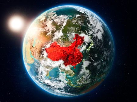 Sunset above China highlighted in red on planet Earth with clouds and visible country borders. 3D illustration.の写真素材