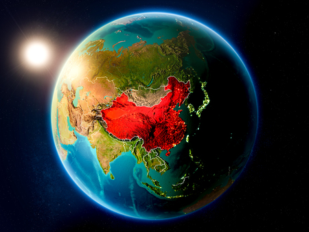 Sunset above China highlighted in red on planet Earth with visible country borders. 3D illustration.の写真素材