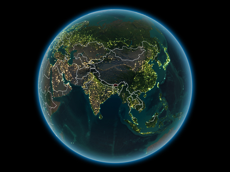 Bhutan in red with visible country borders and city lights from space at night. 3D illustration.の写真素材