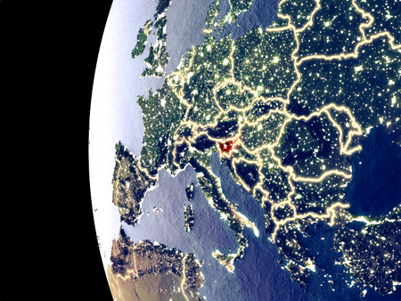 Night view of Slovenia from space with visible city lights. Very detailed plastic planet surface. 3D illustration.の写真素材