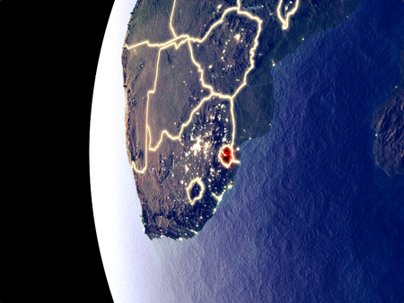 Night view of eSwatini from space with visible city lights. Very detailed plastic planet surface. 3D illustration.の写真素材