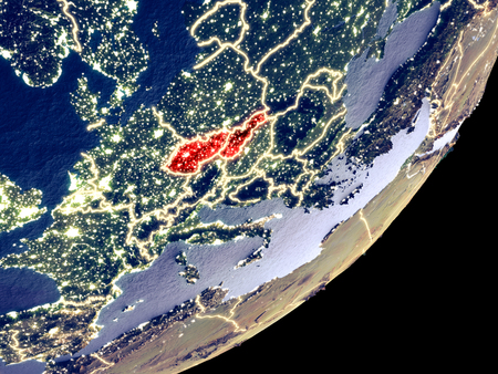 Former Czechoslovakia from space on model of Earth at night. Very fine detail of the plastic planet surface and visible bright city lights. 3D illustration.の写真素材