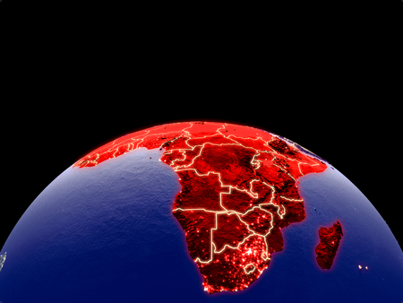 Africa from space on planet Earth at night with bright city lights. Detailed plastic planet surface with real mountains. 3D illustration.の写真素材