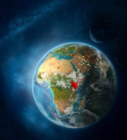 Kenya from space on Earth surrounded by space with Moon and Milky Way. Detailed planet surface with city lights and clouds. 3D illustration.の写真素材