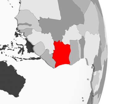 Ivory Coast highlighted in red on grey political globe with transparent oceans. 3D illustration.の写真素材