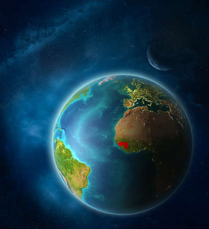Guinea from space on planet Earth in space with Moon and Milky Way. Extremely fine detail of planet surface. 3D illustration.の写真素材