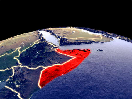 Somalia from space on planet Earth at night with bright city lights. Detailed plastic planet surface with real mountains. 3D illustration.の写真素材