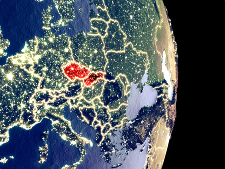 Satellite view of Former Czechoslovakia at night with visible bright city lights. Extremely fine detail of the plastic planet surface. 3D illustration.の写真素材