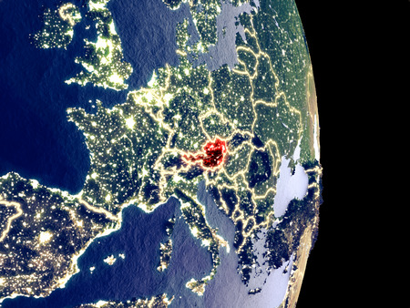 Satellite view of Austria at night with visible bright city lights. Extremely fine detail of the plastic planet surface. 3D illustration.の写真素材