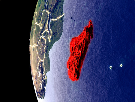 Night view of Madagascar from space with visible city lights. Very detailed plastic planet surface. 3D illustration.の写真素材