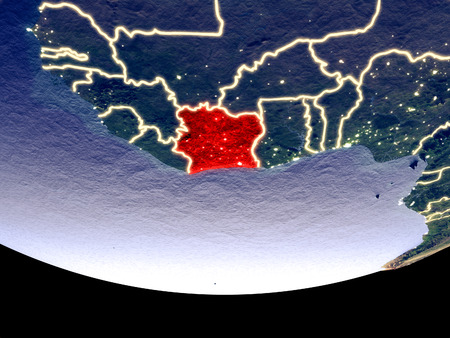 Satellite view of Ivory Coast from space at night. Beautifully detailed plastic planet surface with visible city lights. 3D illustration.の写真素材