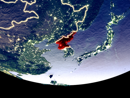 Satellite view of North Korea from space at night. Beautifully detailed plastic planet surface with visible city lights. 3D illustration.の写真素材
