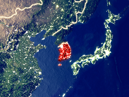 South Korea from space on Earth at night. Very fine detail of the plastic planet surface with bright city lights. 3D illustration.の写真素材