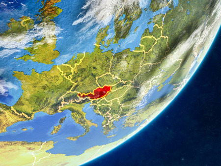 Austria on model of planet Earth with country borders and very detailed planet surface and clouds. 3D illustration.の写真素材