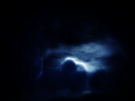 An image of the moonless but cloudy night time sky background.