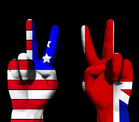 A conceptual image of a pair of hands with UK and USA flags, showing what could be victory,freedom and peace finger gestures.の写真素材