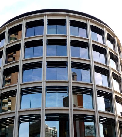 A modern office building that is curved.