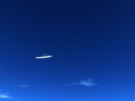 A UFO that is hovering in the sky.の写真素材