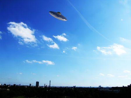 A UFO hovering over the London skyline.の写真素材