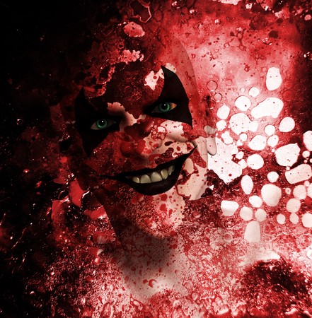 Sinister grinning clown behind a layer of bloodstained texture. の写真素材