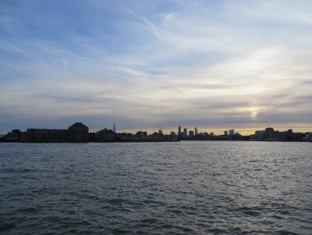 View of the sun setting over the London skyline from The London Docklands                                の写真素材